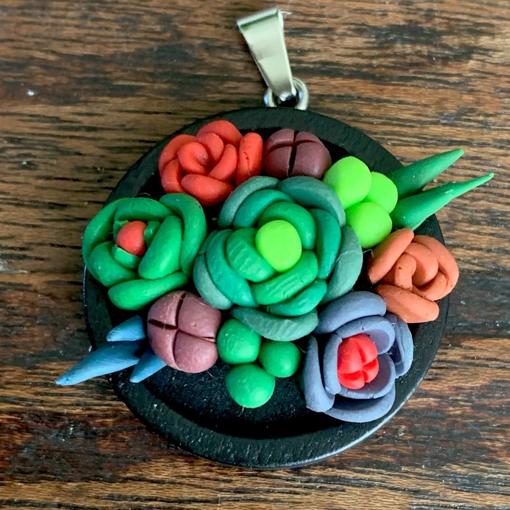 Handmade polymer clay pendant.
